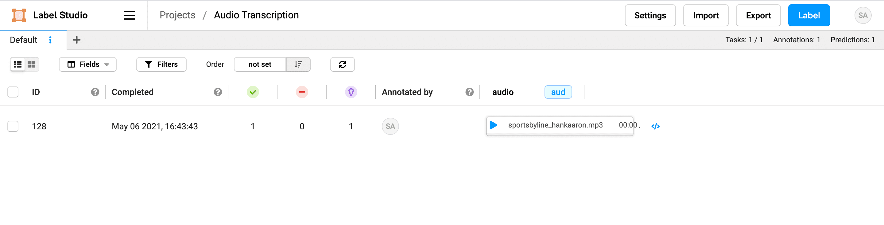 Screenshot of the Label Studio data manager showing the pre-annotated task loaded into an Audio Transcription project.